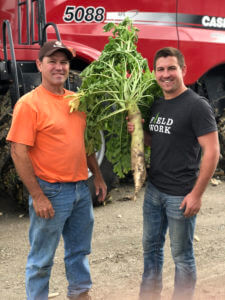 Mitchell with his dad, Brian Hora (left)